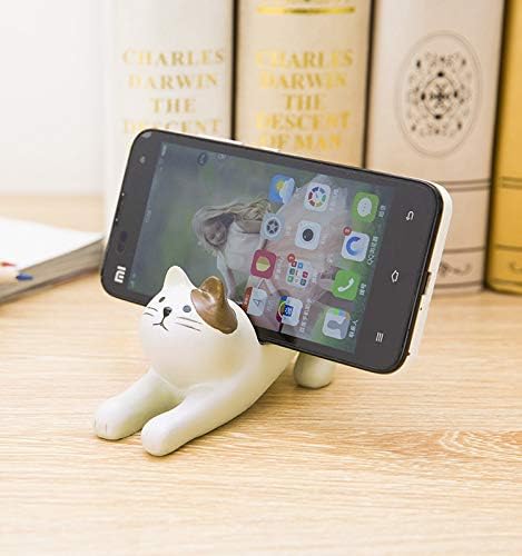 חתול שמנת עם דוכן טלפונים חומים של טלאים אוזניים