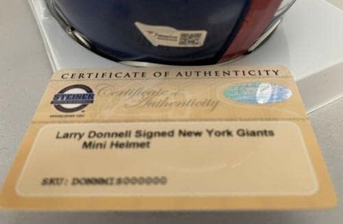 לארי דונל חתם על קסדות מיני של ניו יורק ג ' יינטס עם חתימה של סטיינר